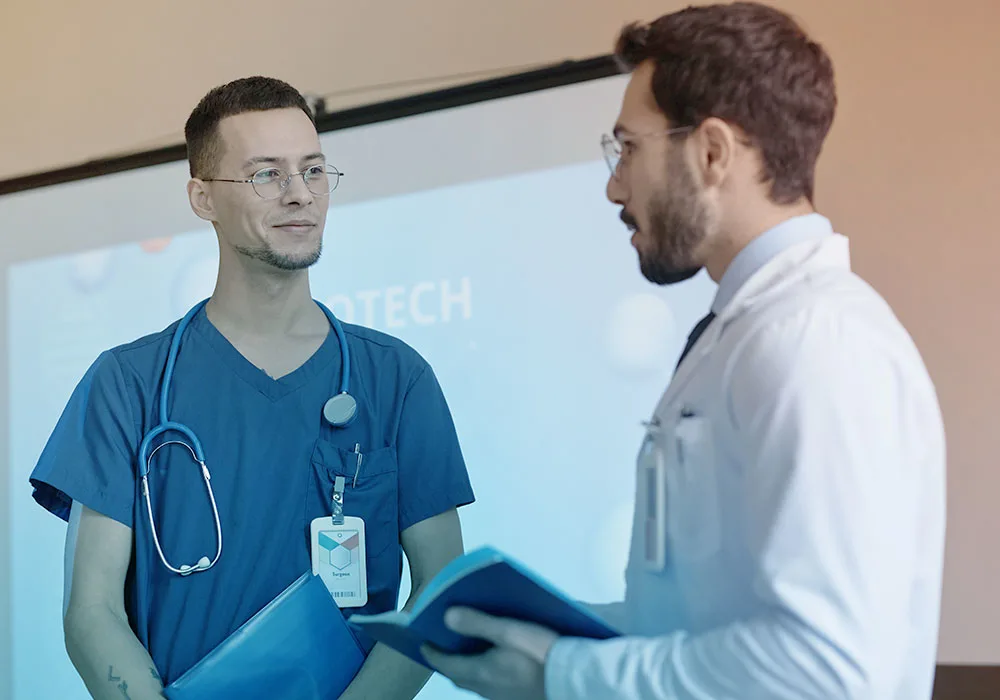 Two eye specialists discussing patient care at Magrabi Eye Hospital Dubai